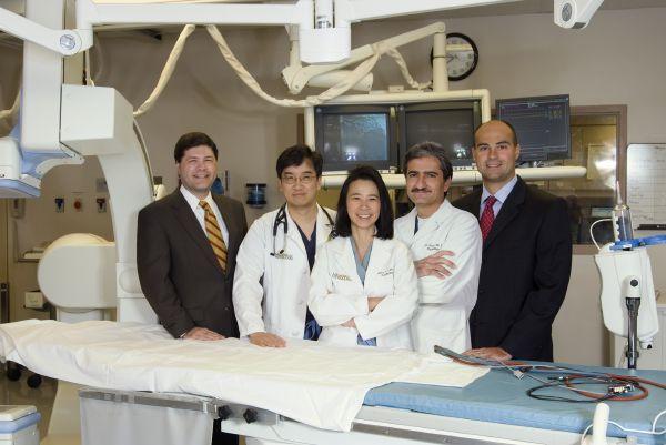 from left, Louis Smith, MHNE CEO; Dr. Ping Wong, Cardiac Cath Lab medical director; Dr. Marcy Lim, Chest Pain Center medical director; Dr. Mazen Ganim, who performed the first invasive cardiology procedure