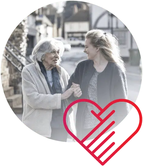 Elderly woman walking with younger woman