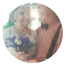 Elderly Couple With Wild Flowers