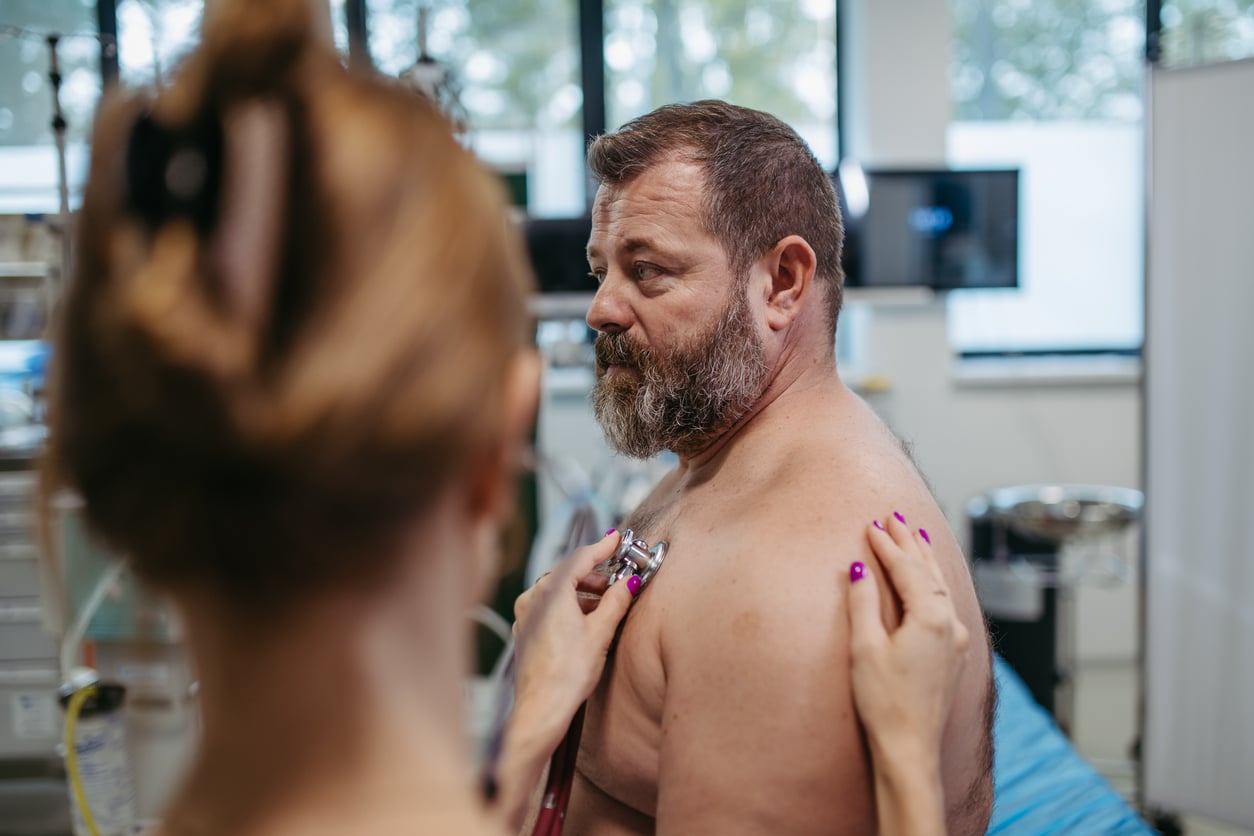doctor listening for a hear murmur